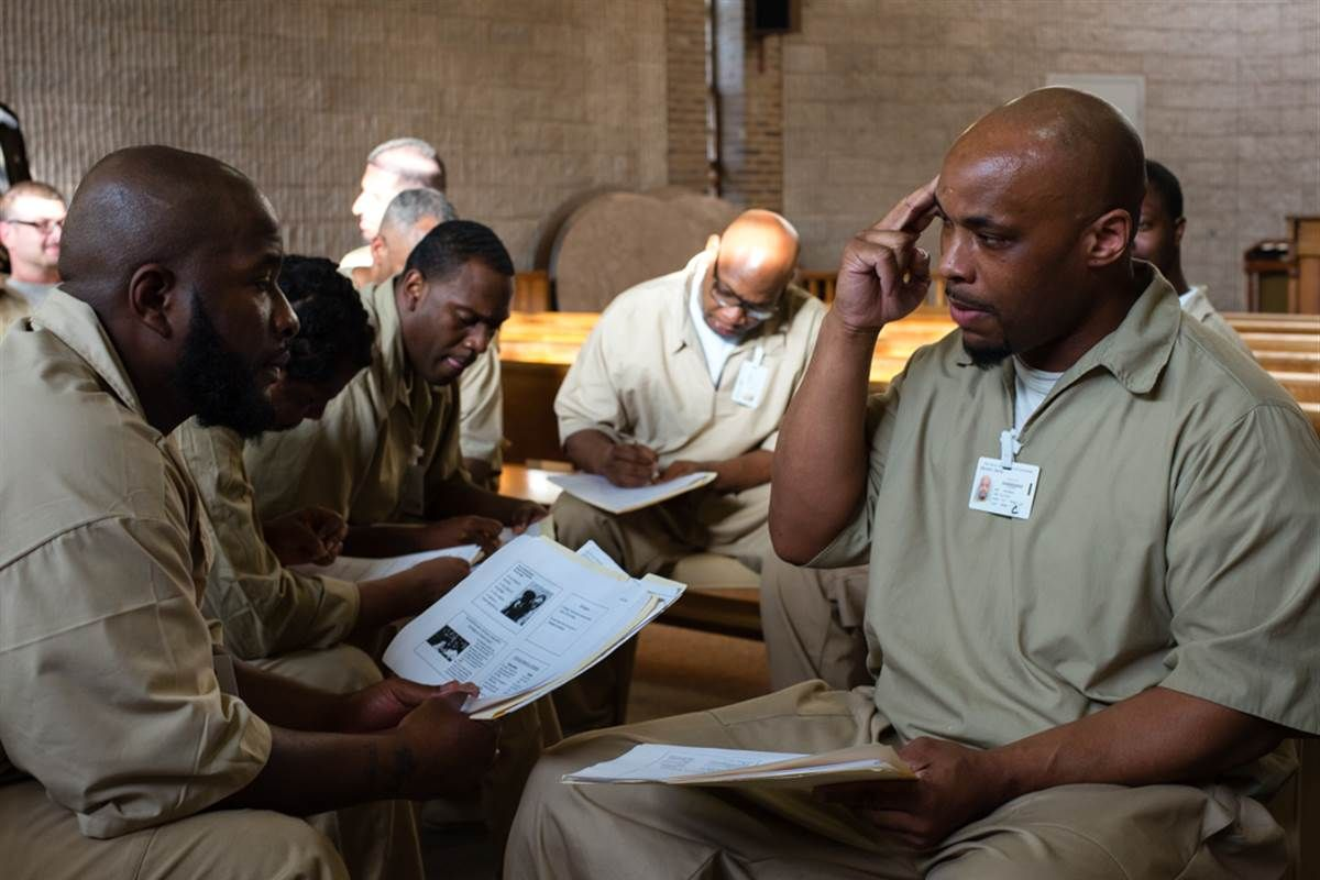 Men engaged in educational program